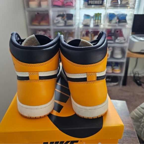 Nike  Jordan 1 Taxi Black and Orange Athletic High-Top Shoes